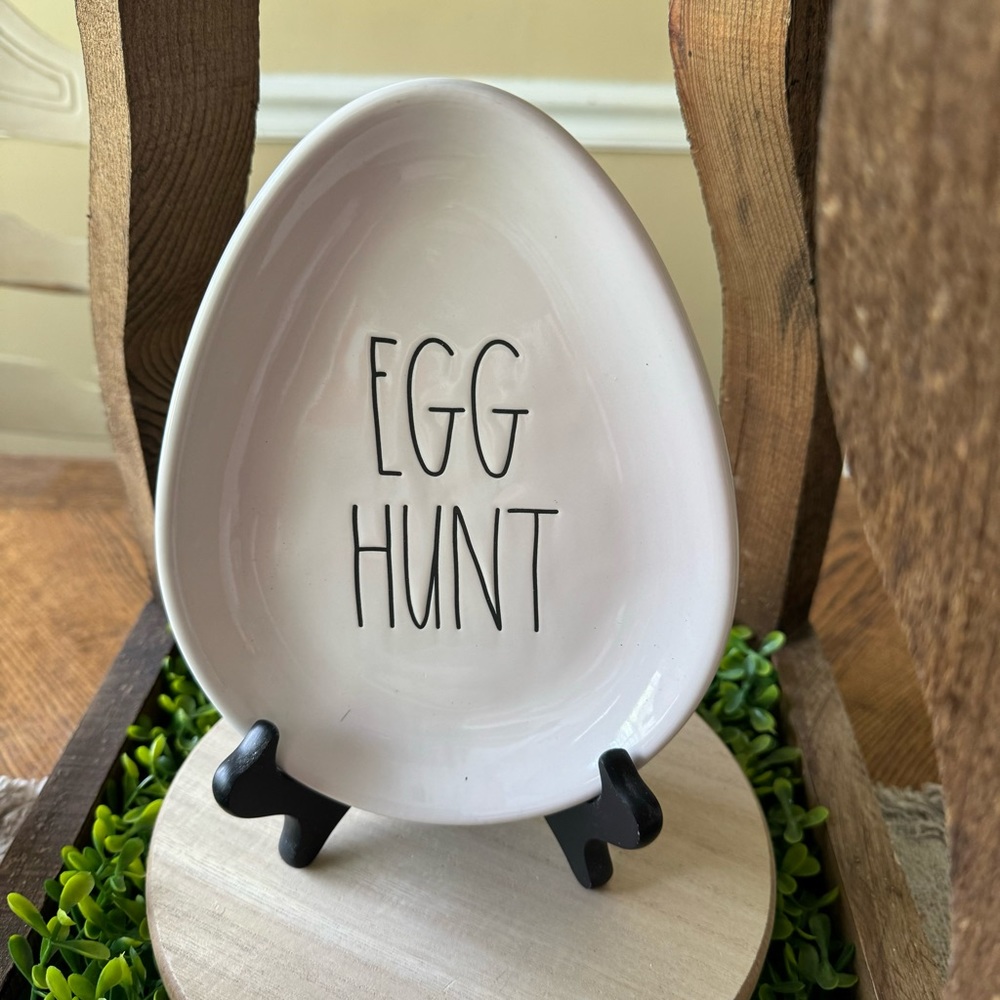 Rae Dunn egg-shaped plate with “Egg Hunt” in the Rae Dunn font.